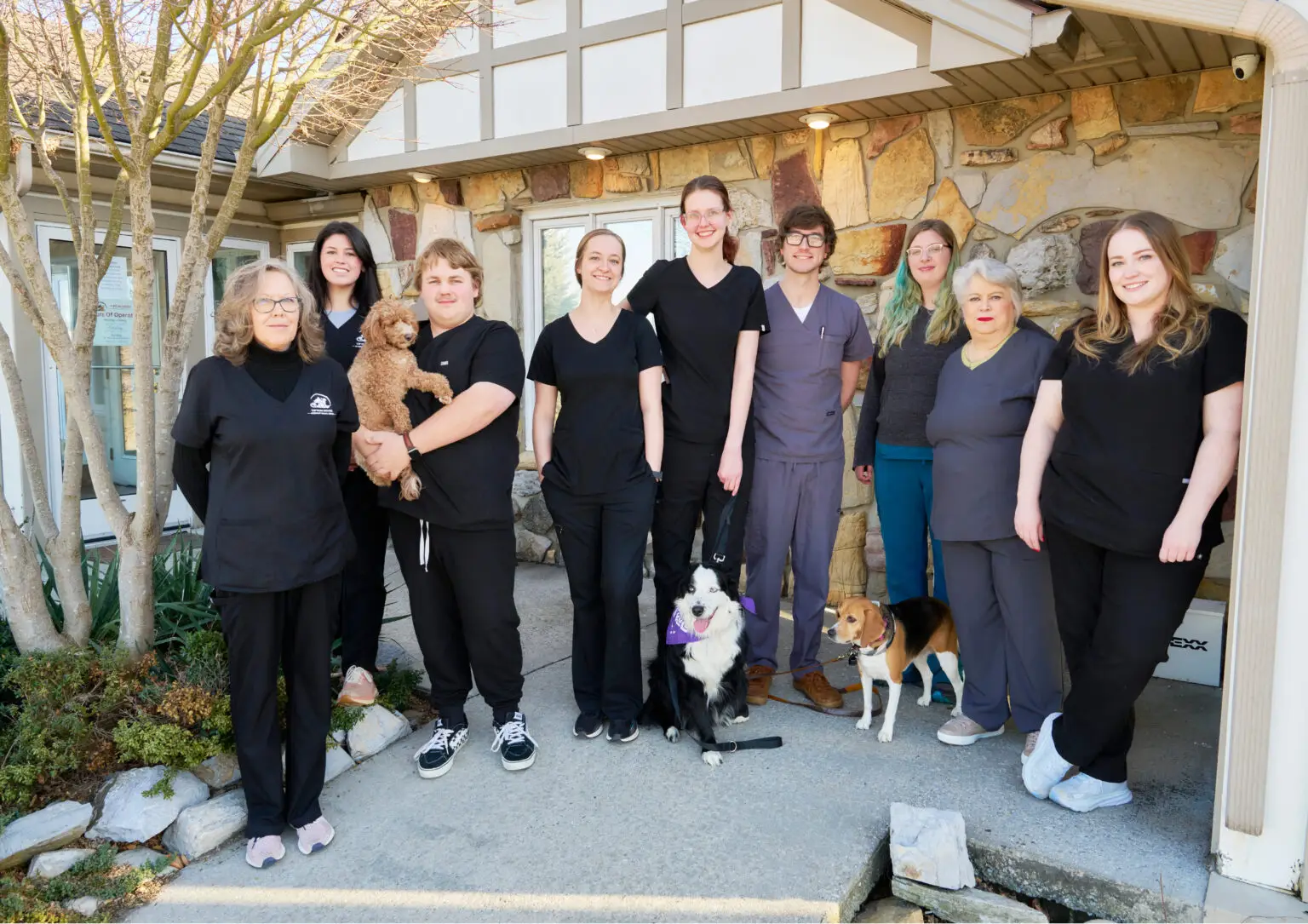 Group photo of the team at Tipton Ridge Veterinary Medical Center standing outside the animal hospital